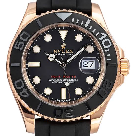 Rolex Sea-Dweller, typically featuring a gold-toned case and a rubber strap With box